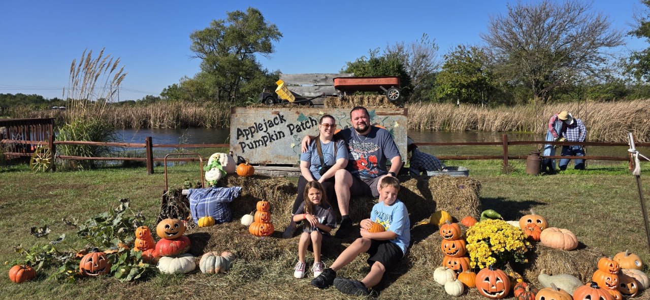 Matthew and Kellie enjoying a pumpkin patch with family